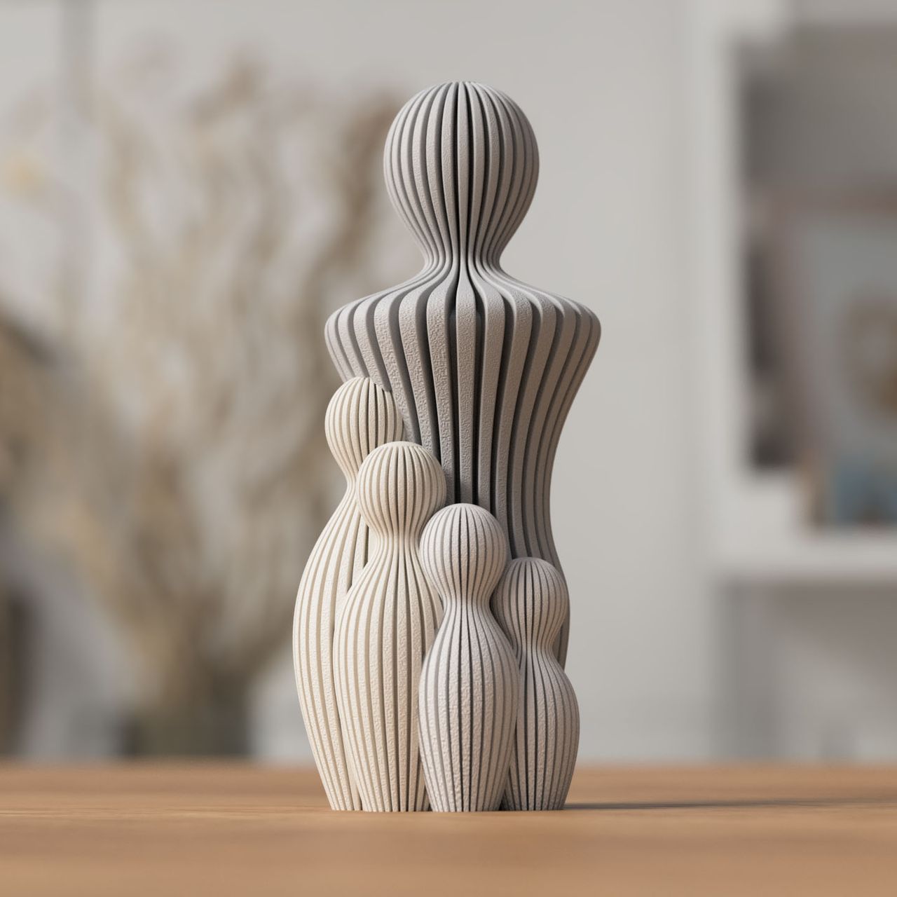 Grå og beige 3D-printet fars dag figur med fem ribbede silhuetter.